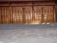 old wooden double doors set in an ancient building in china's beijing suburbs,