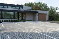 an architectural office building designed to look like an exhibition gallery, and is surrounded by a nice cobblestone area