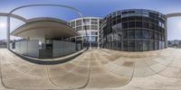 a convex lens view of a building with windows and a circular shape entrance with an open window