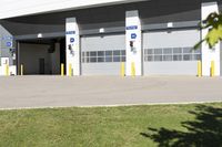 an empty industrial parking garage is located in the daytime light with no cars visible around the entrance