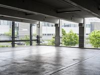 a large room has floor to ceiling windows in it and metal grates covering it