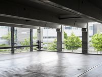 a large room has floor to ceiling windows in it and metal grates covering it