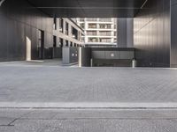 there are several doors leading to the building in this photo, but there is no one who does not have a car