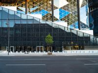 the black glass wall on the building looks very modern and it is empty to see