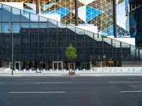 the black glass wall on the building looks very modern and it is empty to see