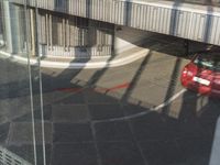 reflection of a bike in the window of an office building or apartment building by itself