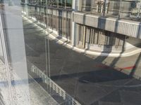 reflection of a bike in the window of an office building or apartment building by itself