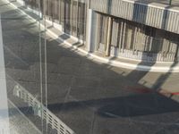 reflection of a bike in the window of an office building or apartment building by itself