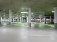 green and white checkered floor in an empty building with large columns and green carpet