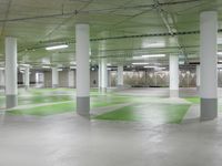 green and white checkered floor in an empty building with large columns and green carpet