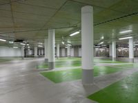 green and white checkered floor in an empty building with large columns and green carpet