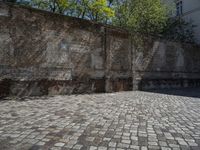 a photo taken in the outdoors area of an old brick building with large brick walls