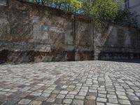 a photo taken in the outdoors area of an old brick building with large brick walls