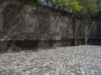 a photo taken in the outdoors area of an old brick building with large brick walls