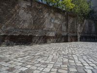 a photo taken in the outdoors area of an old brick building with large brick walls