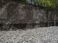 a photo taken in the outdoors area of an old brick building with large brick walls