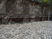 a photo taken in the outdoors area of an old brick building with large brick walls