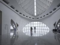 the roof of a building with multiple windows is white in color and has metal rods