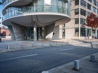 a street corner that has no traffic on it as the sun shines down on it