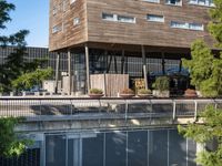 this is the top floor of the building overlooking a river bank in a city area