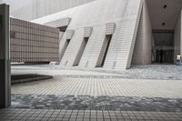 a small courtyard with bricks around the corner and a bench under it to sit on