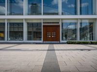 this is an image of a building entrance with an empty street below it and a man walking across a path