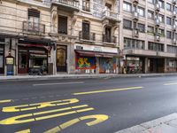 a building with a large window that reads janus journal and a street with traffic