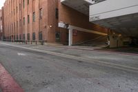 a building is next to an empty parking garage with the roof extended in front of it