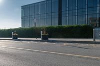 the empty side of a building with a parking lot below it and a sign that reads no parking on it