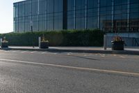 the empty side of a building with a parking lot below it and a sign that reads no parking on it