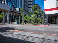 the red and white building is next to a street with a clock on it's outside