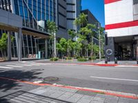 the red and white building is next to a street with a clock on it's outside