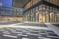 the street is filled with multiple empty areas to be seen through the glass door of the building