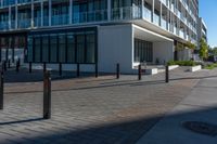 the view from the sidewalk on the sidewalk is empty, so it is clear and the building is made up with windows