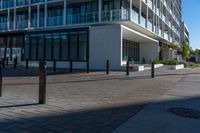 the view from the sidewalk on the sidewalk is empty, so it is clear and the building is made up with windows