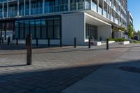 the view from the sidewalk on the sidewalk is empty, so it is clear and the building is made up with windows