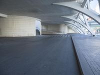 this is an outdoor space with concrete walls and stairs leading to a parking garage area