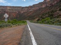 this is an image of a road in the desert area in the usa in the middle of nowhere