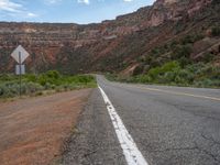 this is an image of a road in the desert area in the usa in the middle of nowhere