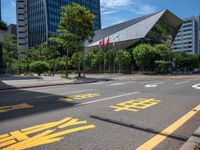 a bus traveling through an asian city on a sunny day outside of skyscrapers and trees