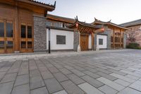 an asian courtyard and building in the city of peking, china of this picture you can see an oriental style