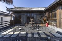 the courtyard of an asian style home in japan, with an area that is very small