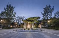 the front entrance to this asian style estate is seen in this image with its stone floor