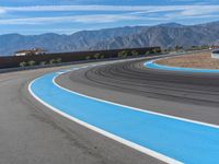 Asphalt Curves on a Race Track with Clouds in the Background