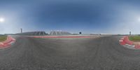 a 360 - up image of an asphalt race track being developed to produce the movement of a circular object