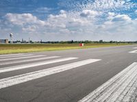 the runway is clean and has markings on it to indicate where they are at the start