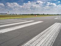 the runway is clean and has markings on it to indicate where they are at the start