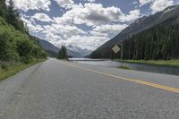 Asphalt Road through Canadian Mountains and Forests