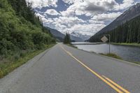 Asphalt Road Through Canadian Mountains and Forests