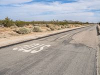 Asphalt Road Under Clear Skies in California